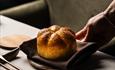Freshly baked bread served on a plate.