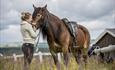 The Norwegian Dolehorse Anna and her rider enjoys eachothers company at the summerfarm