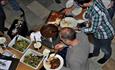 Satisfied people eating food from the catering in Hafjell