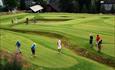 Golf players at the putting course at Nermo