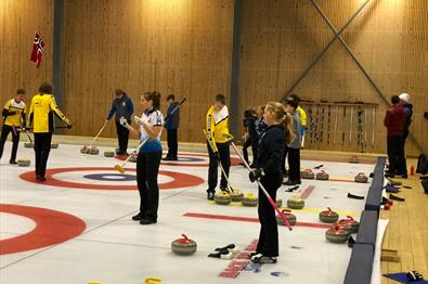 Several teams playing curling