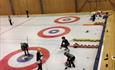 Playing curling