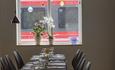 Long table set for customers at Stasjonen Cafe & Restaurant