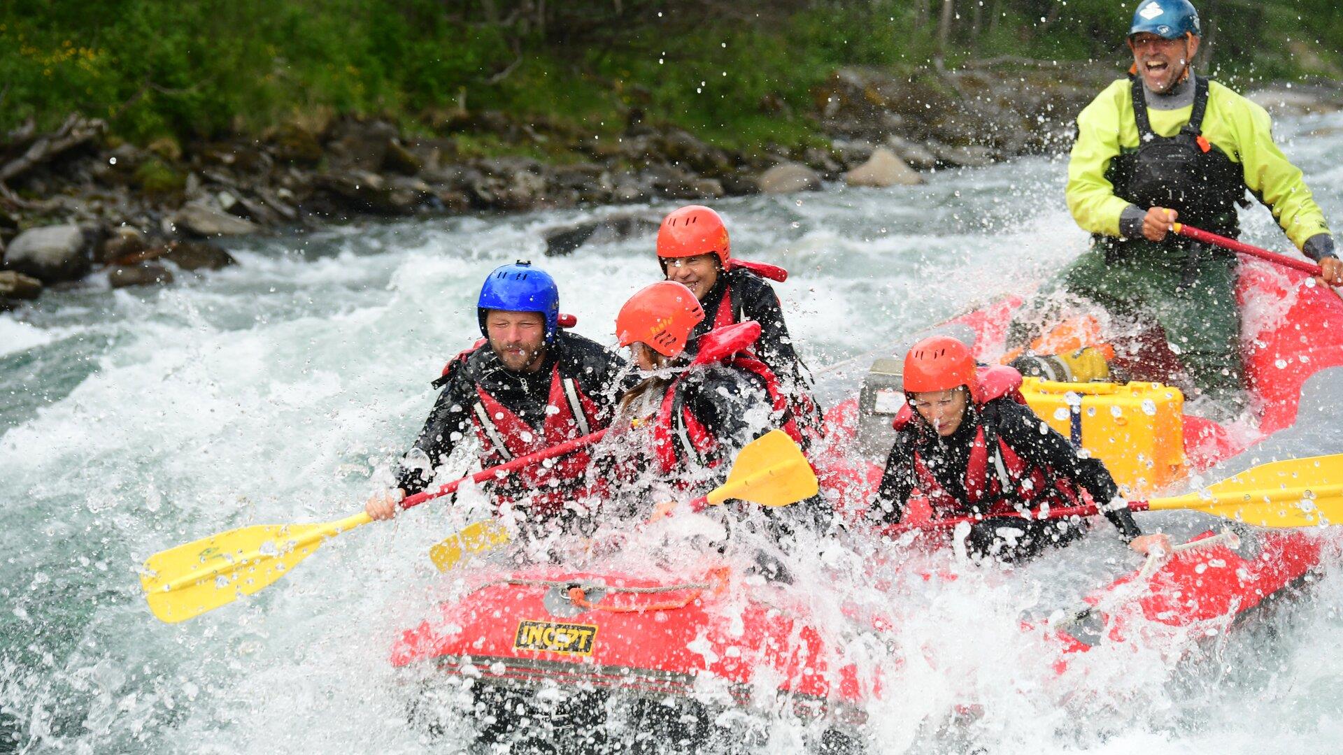 Rafting boat with participants in whitewater rapids. Rafting boat with participants in whitewater rapids.