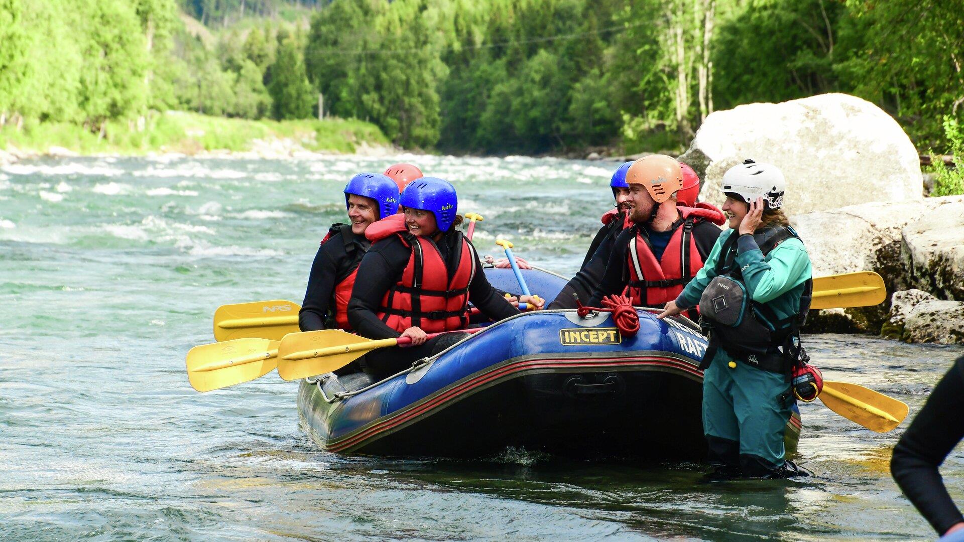 Rafting group gathered by the river before the trip Rafting group gathered by the river before the trip