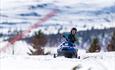 Snowmobile for kids. Winter. Sunshine. Spidsbergseter Resort Rondane.