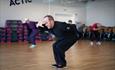 Teacher and students learn Tai Chi