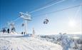 One of the chair lifts in Hafjell in beatiful sun and snow