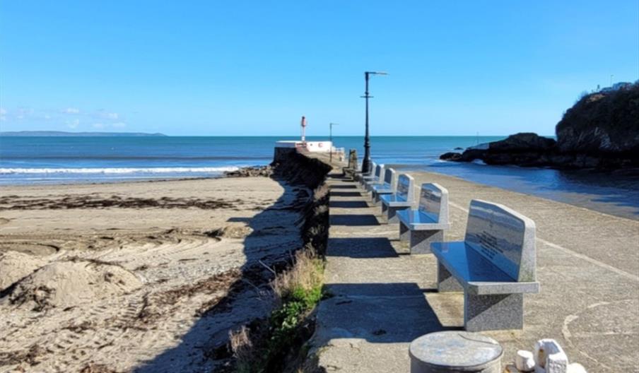 Line of benches at alongside pier.