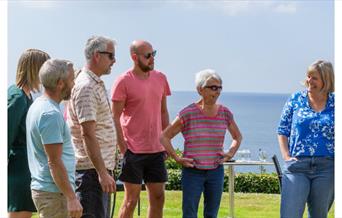 group with sea in background