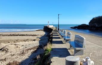 Line of benches at alongside pier.