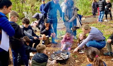 Image of children around camp fire