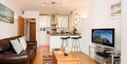 Plaidy Apartment - living area & kitchen
