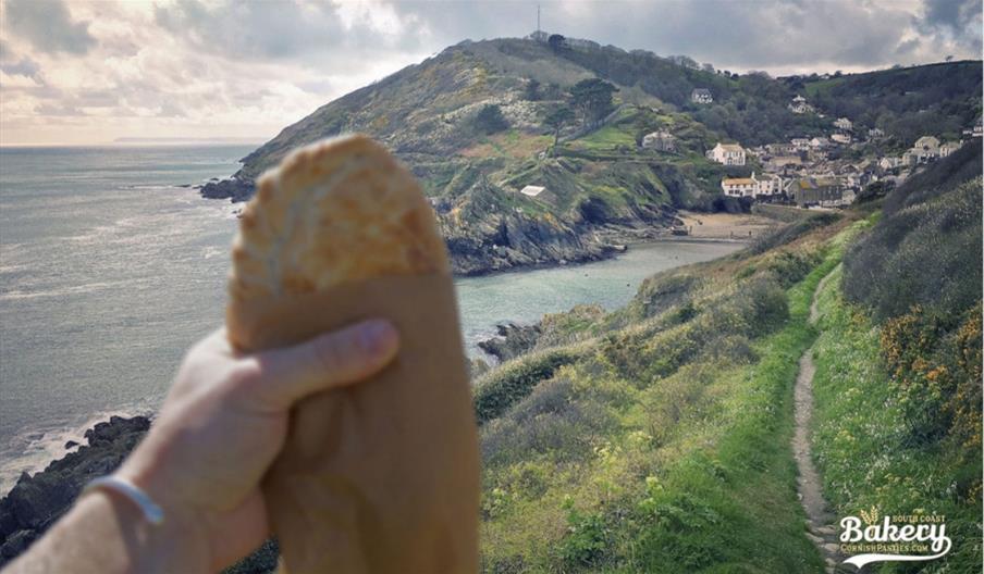 Polperro Bakery - pasty with a background view of Polperro