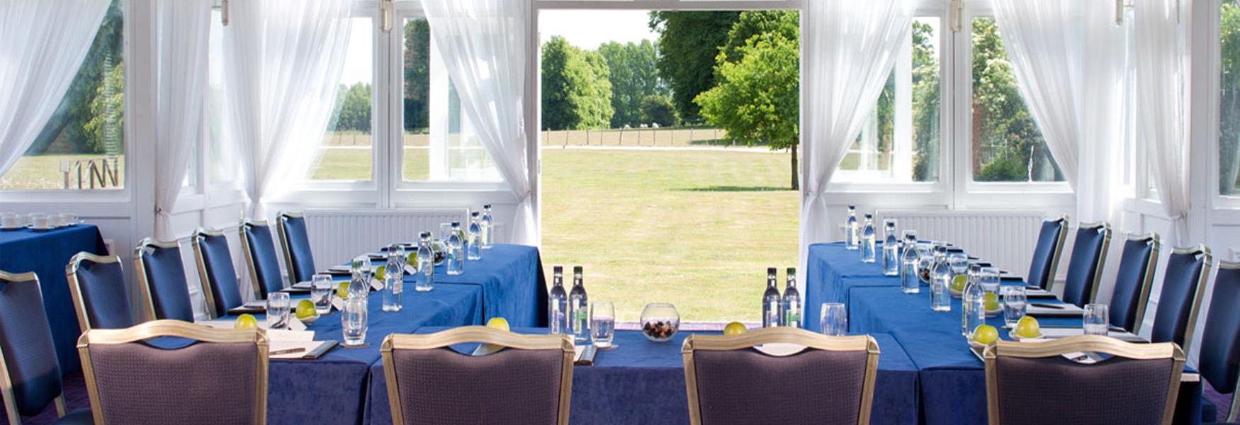 Room with open windows at Chilston Park Hotel