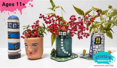 Four clay vases - a lighthouse, a happy face, a cottage with a brick path and a Rapunzel tower