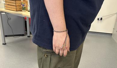 Woven bracelet around wrist
