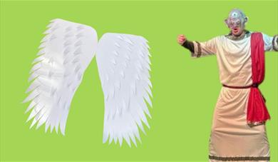 A pair of paper Icarus wings and an actor dressed as a cyclops