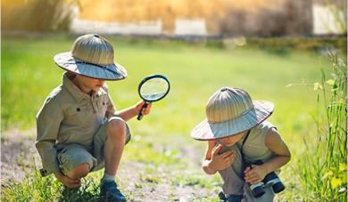 Two children in safari outfits at Leeds Castle
