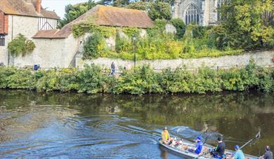 Boat on the the River Medway by the Archbishops Palace and All Saints