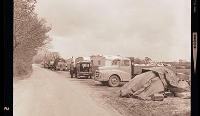 Photo from the Gordon Herd Collection held by Kent Archives at the Kent History and Library Centre reference KHLC-2018/56 showing caravans and motor v