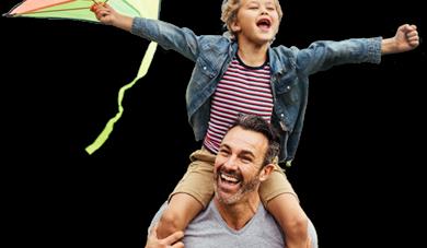 father and son with kite