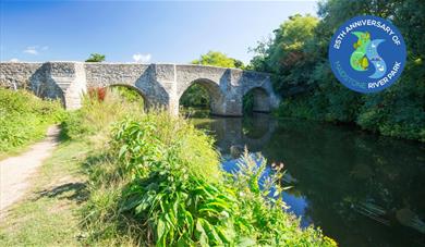 A view of the bridge over the River Medway at Teston Country Park with the public footpath to the left