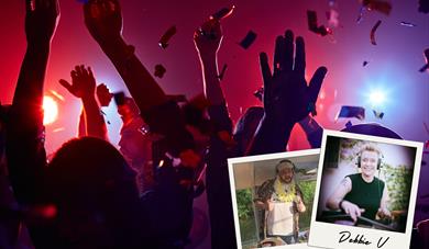 The silhouette of people dancing in a club. There are red lights giving the room a dark red hue. In the corner are two polaroid pictures, with images 