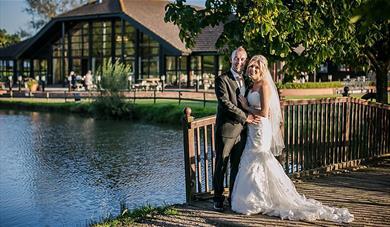 Happy wedding couple outside The Weald of Kent Hotel 