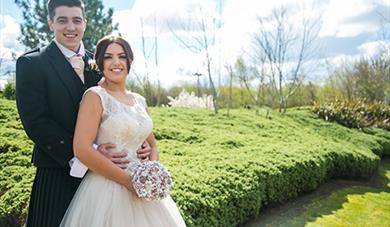 Wedding couple in The Village hotel car park 