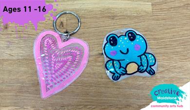 A pink heart keyring and a hand drawn frog keyring