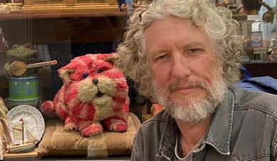 Simon was growing up at the time his father's programmes were made and talks about the ideas and the making of the programme Bagpuss with pictures, ph