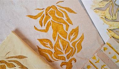 A folk inspired print on a plain tote bag, using natural gold dyes