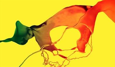 A Splash of Red and Green ink on a yellow background