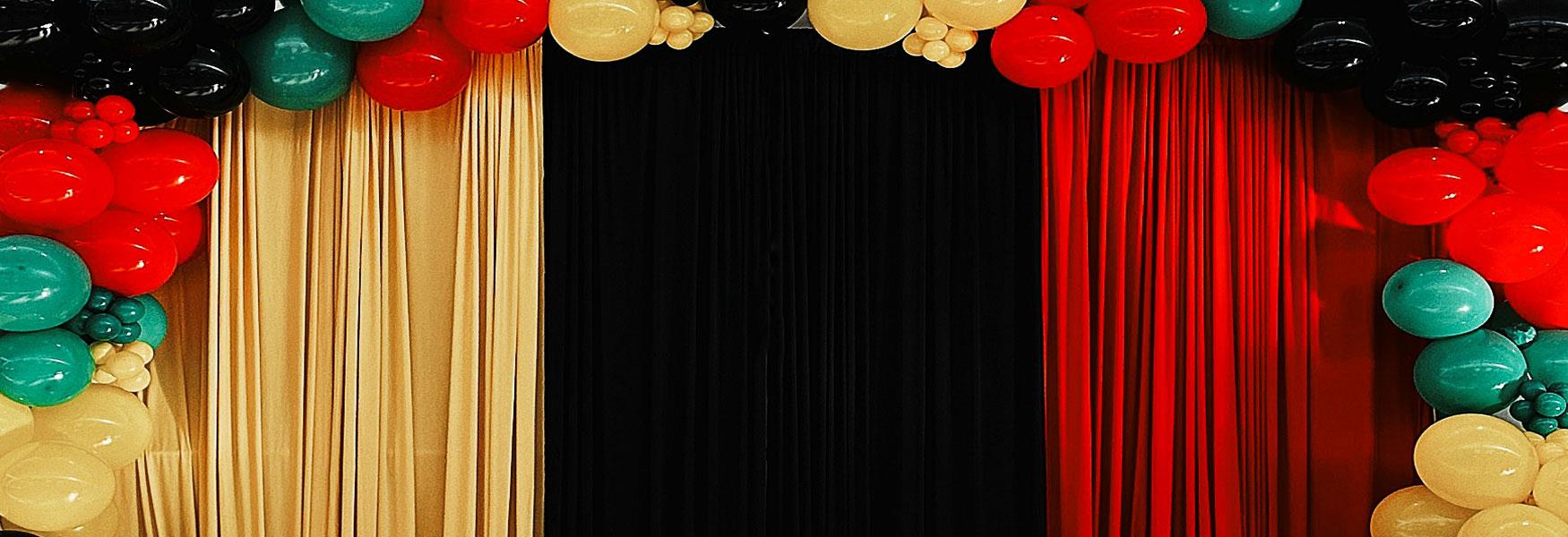 display of balloons in black history month colours