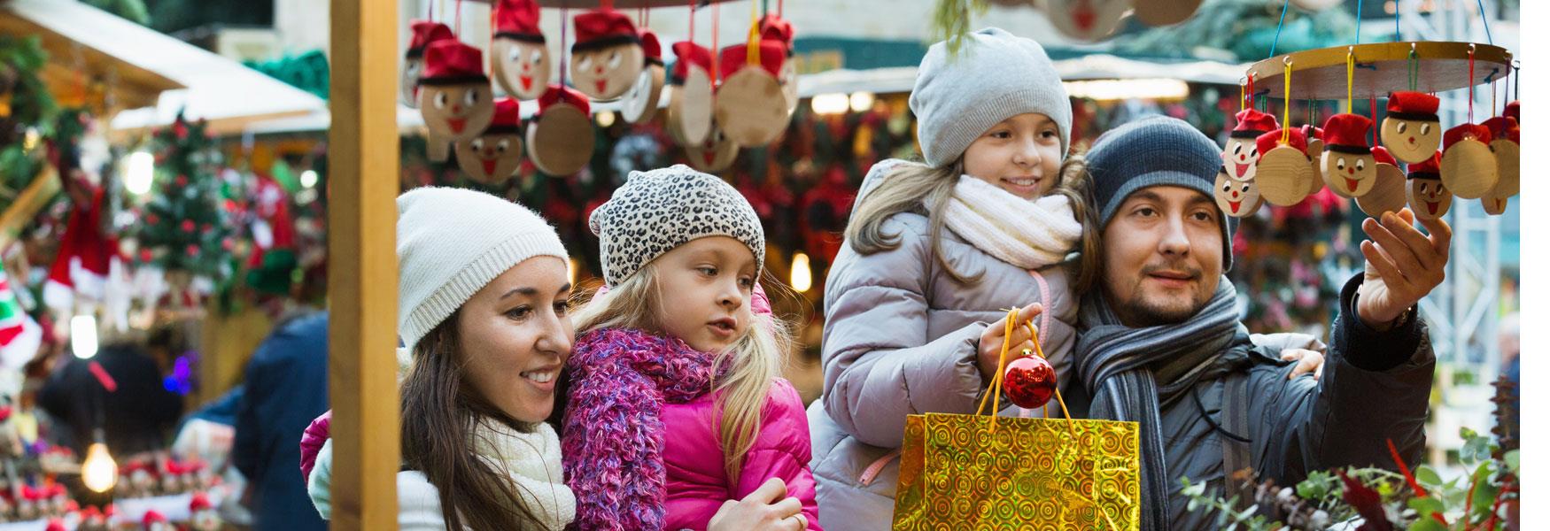 Family looking at items on a stall