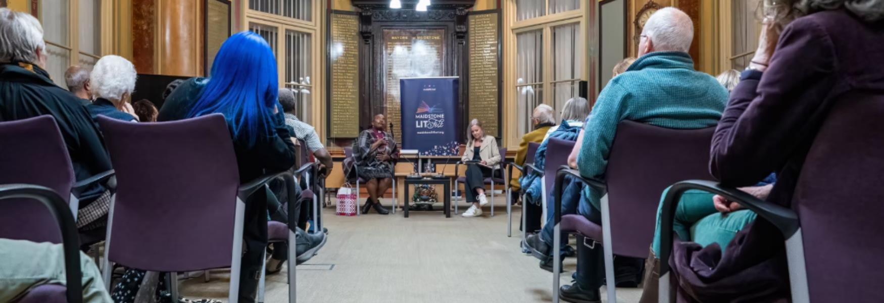 Audience listening to speaker at Maidstone Lit Fest in the Town hall chamber