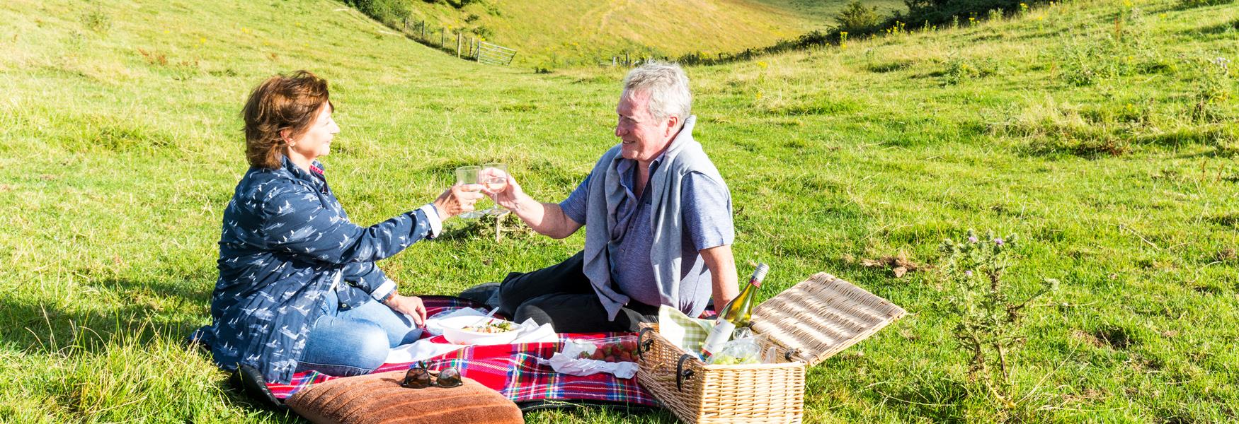 Couple having a picnic on the North Downs