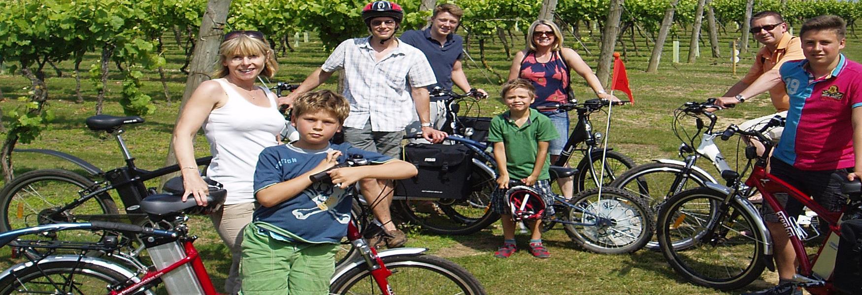 A family group enjoying an electric bike ride