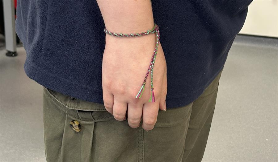 Woven bracelet around wrist