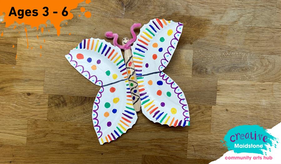 Paint splat with ages 3-6 written on top. paper plate butterfly in the centre