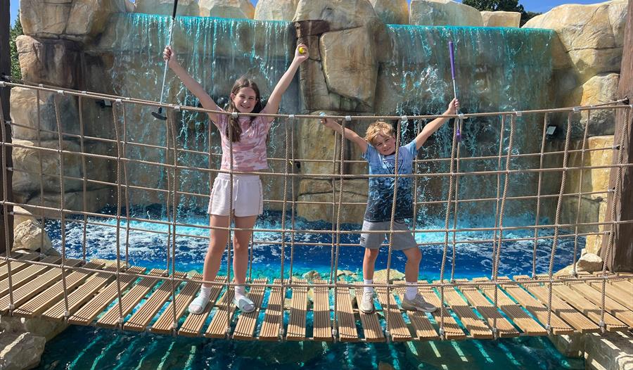 Bridge over the Waterfall and two children