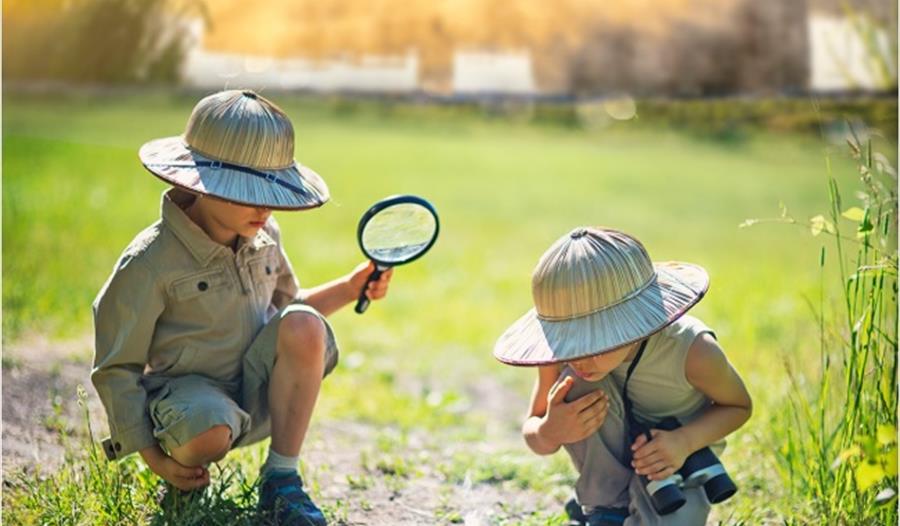 Two children in safari outfits at Leeds Castle