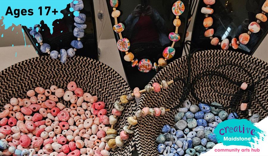 Two baskets of porcelain beads and three porcelain bead necklaces on head mannequins