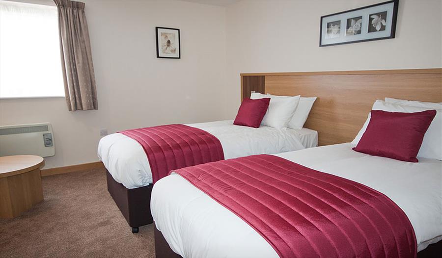 A large twin bedroom at The Weald of Kent Hotel and Golf Course in Maidstone.