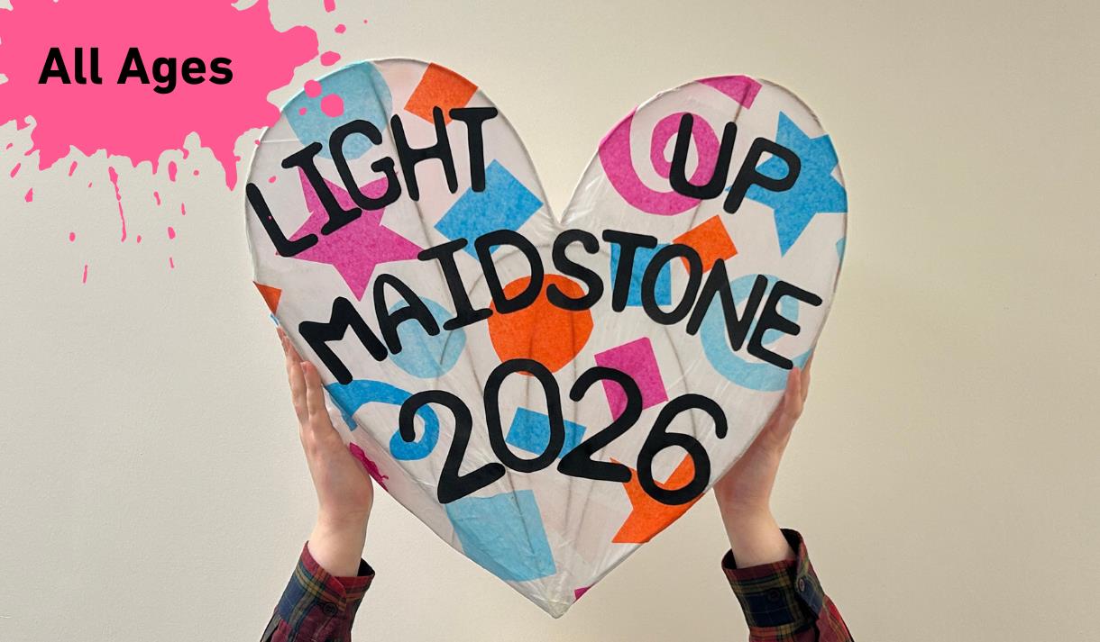 Paint Splat with All ages in the top left-hand corner. Main Image 2 hands holding up a heart-shaped Willow Lantern covered in colourful shapes with th