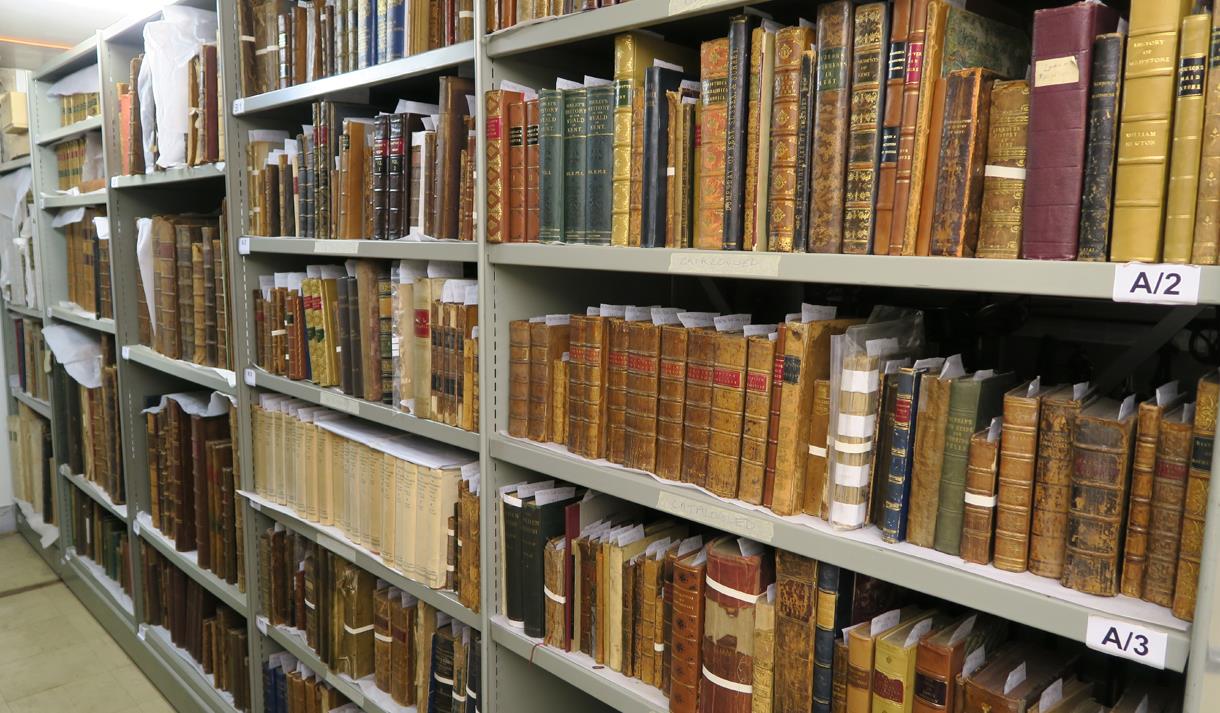 Old books on storage racks in an archive