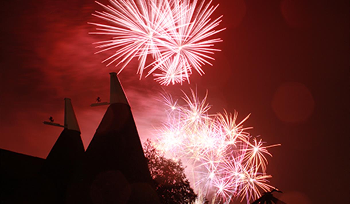 Fireworks over oast houses