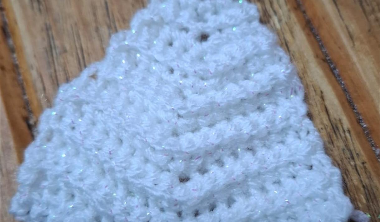 White sparkly Christmas tree made out of crochet