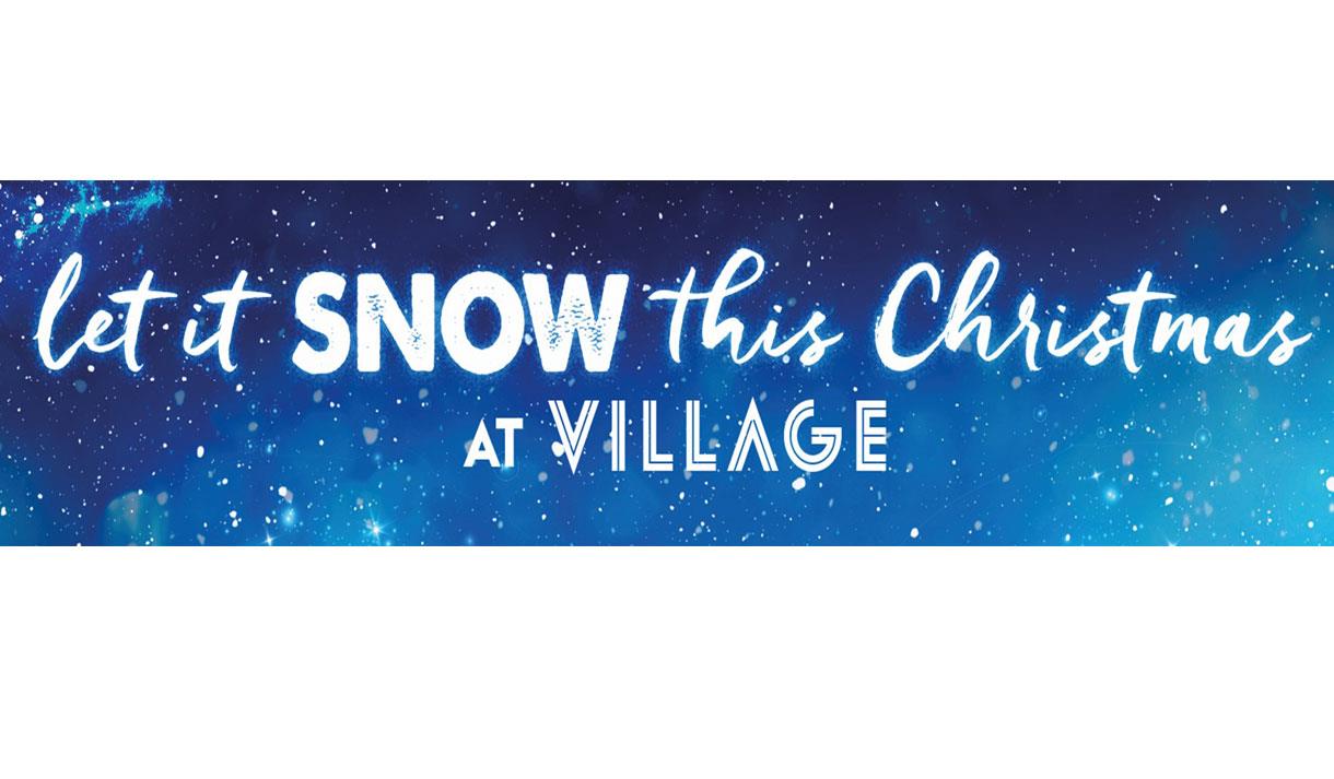 Banner with Let it snow this Christmas Village hotel on a dark blue back ground with falling snow.
